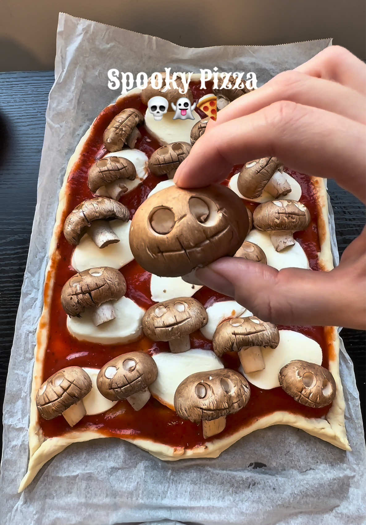 Spooky Pizza 💀🍕 Kicking off the spooky season with a cute ghost pizza 👻 Here’s all you need:  • Pizza dough  • Tomato sauce  • Mozzarella cheese • Mushrooms for the skulls 🍄‍🟫 Bake at 200°C for about 10-15 minutes or until the crust is golden and the cheese is bubbly and delicious. Save this pizza idea for your spooky movie night plans!👻 #halloweenfood #halloweenpizza #spookyfood #halloweenpartyfood #HalloweenTreats   