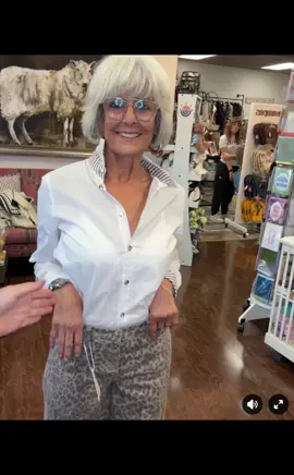 The Bryson Button Down in White/Taupe Stripe puts a playful spin on a classic look. Featuring clean, crisp white fabric with gold buttons and peek-a-boo striped cuffs, this shirt adds a fun surprise to your everyday style. Perfect for mixing timeless elegance with a touch of whimsy.