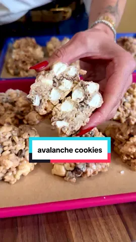 Who's going to make these 5 ingredient NO BAKE PB AVALANCHE COOKIES?!?! I don't crave sweets that often but when I do, it needs to be easy. This is it—a recipe so quick and foolproof, a kid could do it (weekend activity, mamas?). These are fantastic to store in the freezer to enjoy all season long. Comment LINKS for my cute baking trays and items used in this video! Makes 18-24 cookies 3 cups puffed rice cereal 11/2 cups marshmallows of choice 1/4 cup mini chocolate chips (optional, (I used dairy free) 2 cups white chocolate chips (I used dairy free) 1 tsp coconut oil 3/4 cup creamy natural peanut butter In a large bowl, mix together the cereal, marshmallows and mini chocolate chips, if using. Next, in another bowl, add the white chocolate chips and coconut oil. Microwave in 2-3, 30-second increments until completely smooth melted. Stir in the peanut butter and mix until smooth. Line of baking sheet with parchment paper. Scoop 2-3 tb of the mixture and drop onto the baking sheet. Depending on how big or small your cookies are you might get 18, you might get 24! Or if you make big ones, you'll get 12 Refrigerate for 30 minutes to set and then enjoy. You can store in the fridge for one week or in the freezer for up to two months. Brands used: @wholefoods puffed rice cereal, marshmallows and natural pb, @enjoylifefoods dairy free white chocolate chips #nobakedessert #avalanchecookies #kidfriendlyfood  