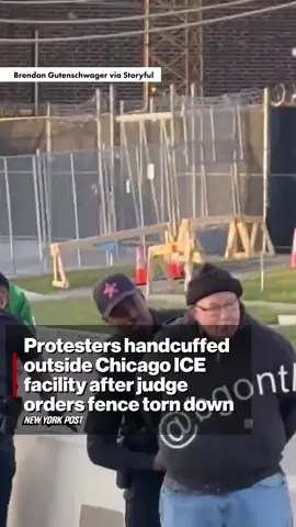 Police handcuffed two protesters outside an ICE facility near Chicago after a federal judge ordered a recently built fence around the site to be removed.