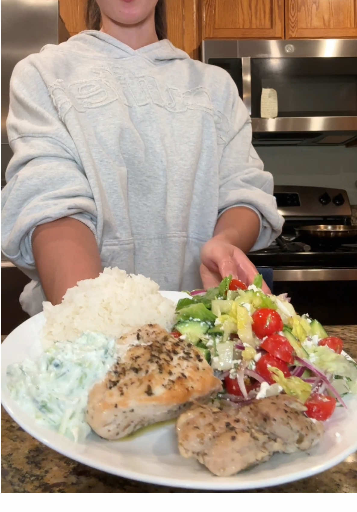 Cooking videos are backkk  Everything I cooked👇🏼 🌟Chicken: seasoned with salt, pepper, dried oregano, and dried dill weed  1. Heat pan to medium. Put oil in the pan and let the chicken cook for 5 minutes on the first side  2. Flip the chicken, pour 1 cup of water into the pan, and cover with the lid. Cook for 4 minutes  3. Turn the stove off but leave the chicken on the stove covered for 15 minutes. Don’t touch it!  🌟Salad: romaine lettuce, cherry tomatoes, English cucumber, red onion, fresh dill, feta  🌟Salad dressing:  1. 1/4 cup fresh lemon juice  2. 1-2 tsp dried oregano  3. 1 garlic clove minced  4. 3-4 tsp salt  5. 3/4 tsp black pepper 6. 3/4 cup EVOO Recipe: https://www.themediterraneandish.com/ladolemono-greek-salad-dressing/ 🌟Tzaziki:  1. 1/2 cup grated cucumber  2. 1 cup plain Greek yogurt  3. 1 tbsp lemon juice  4. 1/2 tbsp EVOO 5. 1 garlic clove, grated  6. 1/2 tsp sea salt 7. 1 tbsp fresh dill, chopped Recipe: https://www.loveandlemons.com/tzatziki-sauce/ #mediterraneanfood #mediterraneanrecipes #greekfood #greeksalad #tzazikirecipe #healthydinner #cookdinnerwithme 