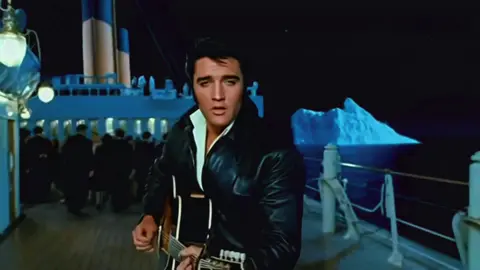 Elvis Presley Stars in Titanic! 🚢🎸 The King Sails Into History What if Elvis Presley starred in Titanic instead of Leonardo DiCaprio? 😎🎤 Picture it — 1950s charm meets 1912 romance. The King strums his guitar on the grand staircase, singing “Can’t Help Falling in Love” as Rose turns to him, mesmerized. 💞 When the ship hits the iceberg, Elvis grabs her hand and says, “We ain’t sinking, baby — not tonight.” 🚢💔 It’s rock ’n’ roll meets tragedy, and no iceberg can cool off this kind of fire. 🔥 Would Titanic have ended differently if Elvis was on board? 👑 #ElvisPresley #Titanic #TheKing #AIArt #ElvisLives           