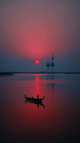 A wonderful view of sunset a small boat is moving on a lake. #sunset #boat #viral #foryou #lake 