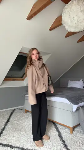 trenchcoat buttoned to the top