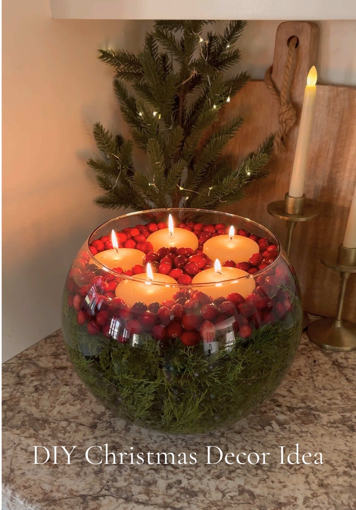 DIY Christmas decor idea! 🎄 This is so easy and affordable to make! It looks so pretty and cozy for Christmas time!🎄 I used cedar branches from a tree in our yard and got the cranberries and candles from Walmart! You can also get the candles on Amazon! You can use any size jar or bowl but I liked the large design of this bubble vase! I’m getting so excited for Christmas! I did put my tree up already but I haven’t added any ornaments or anything! Don’t be mad at me lol  🫣 I always start early to sort of ease into things.😂  It takes me a little while to get my house all the way decorated so I start usually in October! That also gives me time to get everything decorated and record content to share before the holidays are over lol. Plus if I get the decorating done early, we get to sit back and enjoy it through the holiday season! I love decorating but it’s a lot of work. So I like to do it, be done, and relax through November and December.. lol 🎄😍 I can’t wait to share my new tree with y’all! It’s one of my favorites! What’s your “decor theme” this year? #christmas #christmasdecor #diychristmas #christmasdiy #christmasdecorating 