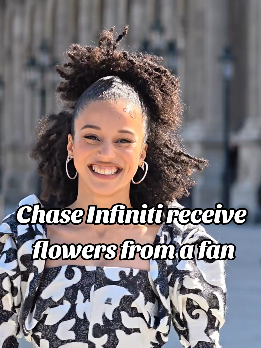 Chase Infiniti gets flowers from a fan after the @louisvuitton show during Paris Fashion Week.💐 #paris #chaseinfiniti #louisvuitton