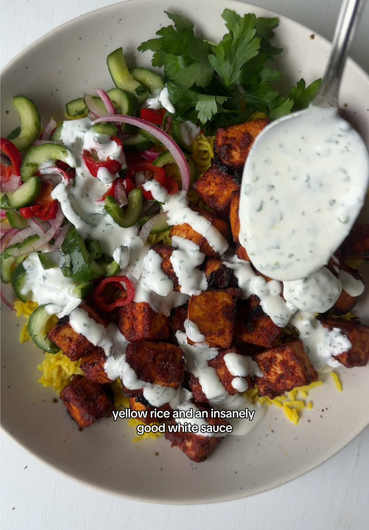 Harissa tofu bowl with halal-style yellow rice and white sauce🤍💛🥣🥒  This was such a good bowl and the flavor combo is insane. If you need some dinner inspo this week let this be your sign ✨ L1nk in bi0 for the recipe! Make sure to be subscr1bed for this one 🫶 #tofurecipes #harissa #vegandinnerideas #halalstyle #plantbasedrecipe  