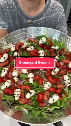 Graveyard Greens 💀🥗 Ingredients: 3 cups cherry tomatoes, 12 basil leaves, 5 cloves minced garlic, 1/2 teaspoon salt and pepper, 3 tablespoons olive oil, 2 teaspoon balsamic vinegar, 1 tablespoon balsamic glaze, fresh spinach, fresh arugula, fresh mozzarella  Marinate tomatoes for 24 hours. Use skull mold to melt mozzarella down for 4 minutes at 300°. Remove from oven and smash and mold. Let cool and remove. Add them to salad.  #graveyardgreens #halloweensalad #capresesalad #halloweenrecipe #halloweenpartyidwas 