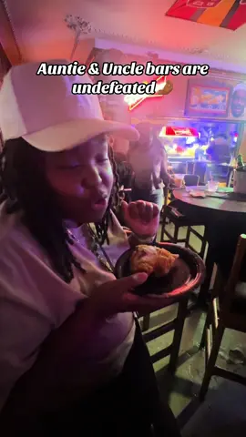 Auntie & Uncle bars always got the best food, music, and vibes 🍗🎶 #AuntiesBeLike #UnclesBeLike #BlackTikTok #LifeOfATW #GoodVibesOnly #BarTok 