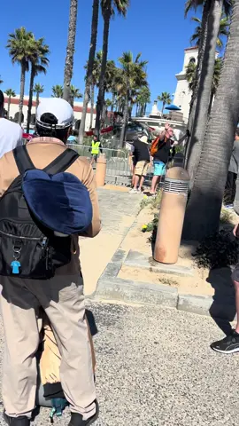 The helicopter pilot hit the palm trees and got wedged in there probably saved his life.  I was praying so hard as ran over there! I have walked over that bridge to the Hilton so many times #helicopter #huntingtonbeach 