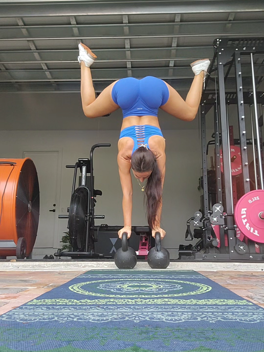 handstanding on kettlebells! it's actually pretty easy