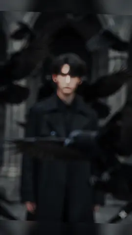 Hoàng Tử Quạ Đen ( Tạo Ảnh bằng gemini).  prompt: Using the uploaded picture 100% exactly face 8K Hyper-realistic, a cinematic portrait of a man, his hair is messy over the eye, [keep the real face from the uploaded image], wearing a long dark trench coat, surrounded by black crows flying dramatically around him. Some crows fly very close to the camera with motion-blurred wings, others perch on his shoulder or nearby. His expression is serious and enigmatic, half of his face partially obscured by a crow in the foreground. Dark moody lighting with strong contrast, deep shadows, and cinematic highlights, evoking a mysterious, intense atmosphere. #viral #promptai #trending #xuhuong #gemini 