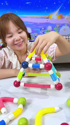 If your toddler hasn't tried open-ended toys, you NEED this magnetic pull-rod! 🧲 Just pull it like a straw – it extends and bends anywhere! The magnetic ends make building so easy, and their creations actually stay together. 🎨 Seriously! It's mind-blowing for their creativity & imagination. ✨#openendedplay #montessori #toddlertoys #stemtoys #creativeplay 