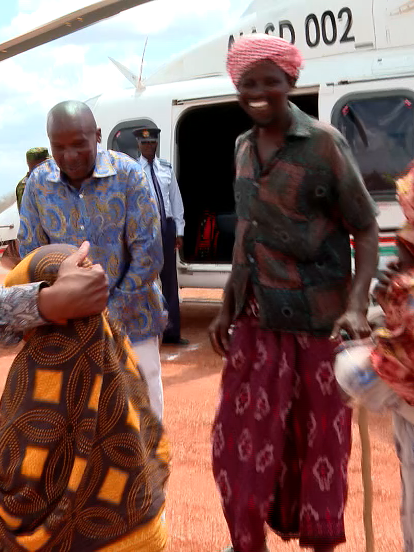 A FAMILY INTERACTS  WITH DP IN FAFI, GARISSA COUNTY.