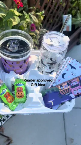 Spooky season Reader-approved gift idea ☕📖👻 A glass for your pumpkin spice, a soft sleeve to keep it cozy, bookmarks for your haunted TBR, and a little candy because trick-or-treat.  Ps. Kindle girlies just sub the bookmarks for stickers!  #readerapproved #spookyseason #bookishgifts #halloweenvibes #oakshorecollective