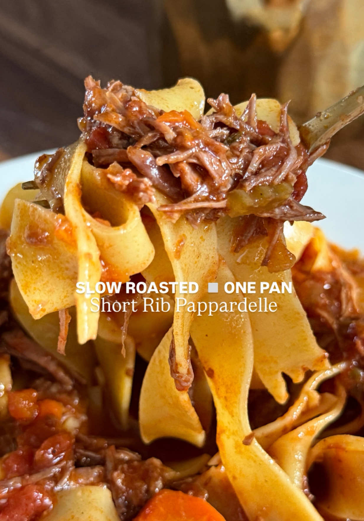 My Short Rib Pappardelle is the ultimate dish to impress —rich, tender braised short ribs slow-cooked to perfection in a luscious, savory sauce, then tossed with wide, silky pappardelle noodles. Every bite is packed with deep, cozy flavors, making it the perfect meal for a special night in or when you’re craving something truly indulgent! INGREDIENTS: 	•	3tbsp olive oil, divided 	•	2-3lbs short rib (I used boneless, can use bone-in), heavily with salt and pepper on both sides 	•	3 carrots, small diced 	•	3 celery ribs, small diced 	•	1 white/yellow onion, small diced 	•	5 garlic cloves, minced 	•	2tbsp tomato paste 	•	2 cups dry red wine (I used cabernet) 	•	1-28oz can San Marzano tomatoes, crushed 	•	3 cups beef broth/stock (+ more, if needed to fully submerge meat) 	•	3 sprigs fresh thyme 	•	4 sprigs fresh rosemary 	•	1 bay leaf 	•	1tsp salt, more to taste 	•	Rind of parmigiano cheese (optional) 	•	1lb parpadelle pasta (or really, any pasta) INSTRUCTIONS: 	1.	Preheat oven to 300 degrees. Season short ribs generously with salt and pepper.  	2.	In a large Dutch oven, heat 2tbsp olive oil on medium-high heat. Once heated, add short ribs and sear on all sides (2-3 minutes each side) until golden. Remove from the pan and set aside. NOTE: do not overcrowd pan; you may need to sear in batches. 	3.	Reduce heat to medium. Add onions, carrots, celery and garlic with a sprinkle of salt. Cook for 7 minutes, stirring occasionally.  	4.	Add tomato paste and cook for 3 minutes before incorporating into vegetables. Mix. 	5.	Increase heat to medium-high and add red wine. Cook down for 5 minutes. 	6.	Add crushed tomatoes, beef broth and salt. Mix. 	7.	Return seared short ribs back to the pan.  NOTE: They should be almost fully submerged in liquid - if not, add more beef broth/stock until they are. 	8.	Add thyme, rosemary, bay leaf, and cheese rind (if using). Cover and cook at 300 degrees for 3 hours or until meat is tender enough to shred easily with a fork (or even your fingers!). 	9.	When ready to serve, cook pasta and mix into short rib pan. 	10.	Top with parmigiano cheese and Enjoy! #shortrib #parpadelle #sundaysauce #shortribparpadelle #thecookingmawma 