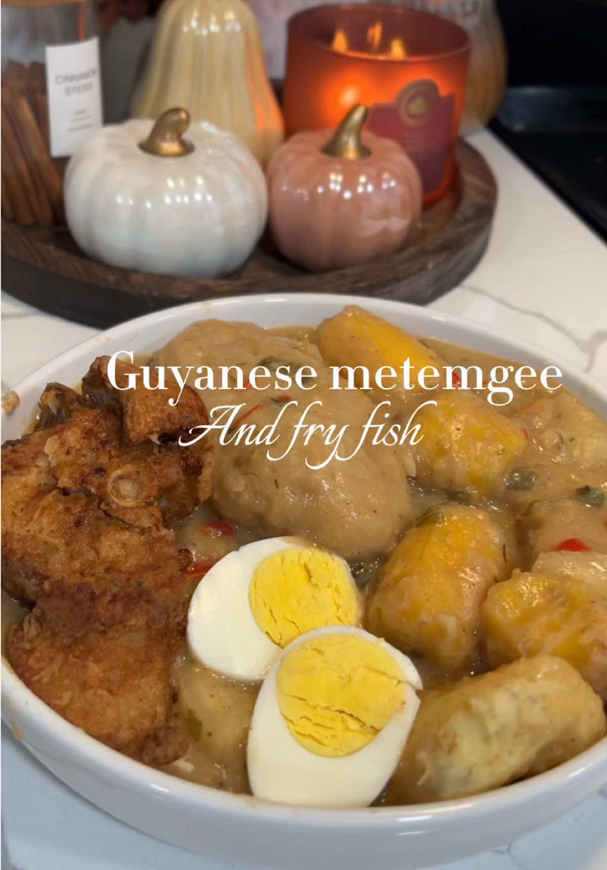Let’s make my Sunday lunch , Guyanese metemgee with fry fish . This meal brings back so much childhood memories, especially  me sleeping on the back step after eating this on a Sunday afternoon 😂. Ingredients :🥘 Cassava  Plantain  Sweet potato  Eddo  Sweet pepper  Scotch bonnet/ riri pepper  Shallot  Onion  Thyme  Coconut milk (two fresh coconut/1 can coconut )  Onion powder  Garlic powder  Paprika  Chicken bouillon  Black pepper  Duff .  1 cup flour  1/2 cup water  1 tbs butter  1 tsp baking powder  1 tbs sugar   Steam in pot with cover on for 8 mins .  #sundaylunch #guyanesetiktok #guyanesedish #lunch #fyp 