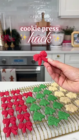 This cookie press might change my life this holiday season 🤩 be sure you use a nonstick pan and press cookies directly onto pan. I love my @Caraway Home pans you can use code JAMIE for 10% off #baking #cookiehacks #momhacks #holidaycookies #christmascookies 