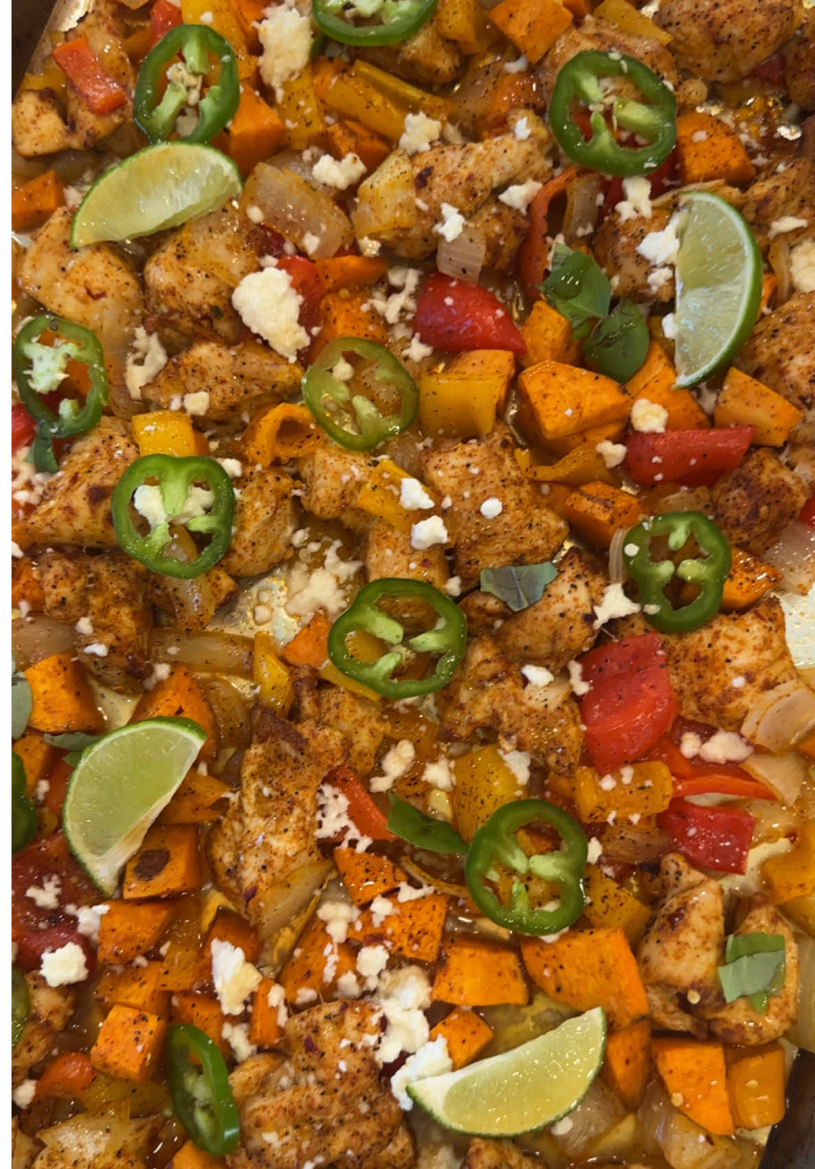 Hot honey and sweet potato sheet pan dinner 😍 So quick and easy! This is going to be your new favorite recipe for busy weeknights or meal prep. The whole thing takes less than 30 minutes and is full of protein and flavor! RECIPE: Preheat oven to 350 degrees. Peel and dice 1-2 sweet potatoes into bite size pieces. Chop onion and sweet peppers to your preferred size and amount. Add vegetables to a sheet pan. Add your diced chicken, you can use breast or thighs. Drizzle everything with 2 tbsp of oil. Add taco seasoning to your chicken and garlic powder, paprika, salt pepper and red pepper flakes to the vegetables. Mix everything well, add a drizzle of hot honey and bake for 20-25 minutes or until chicken and potatoes are done. Top with jalapeños, feta or cotija cheese, lime and a few basil leaves. ✅  #EasyRecipes #DinnerIdeas #simplerecipes #easymeals #dinner         