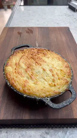 Twice Baked Garlic and Chive Mash. I have made this at a couple of private events recently - always goes down a storm. Very easy going and very very comforting. So why bake it? And why baked it twice? Baking your potatoes for mash will up the flavour you get significantly. The second bake is to get a nice crispy edging and they are also enriched by the egg yolk. 1kg Maris piper potatoes 180g butter 8-10 garlic cloves 100-150ml hot milk Chives 1 egg yolk Salt/Pepper Cheese of your choice for the top. 1. Bake the potatoes at 180c for 50-60 mins or until tender  2. Meanwhile confit the garlic in the butter on a low heat, when totally soft and a little browned mash the garlic up. The butter needs to be cooled completely  3. Pass through the potatoes through a sieve or ricer (save the skins for something else) 4. While the potato is still hot work through the butter in stages then add the milk 5. Season to taste with salt and pepper, add the egg yolk and chives 6. Add to an oven proof dish smooth over the top, create some groove with a fork and top with cheese 7. Bake at 200c for 20 mins  #potato #sidedish #reels #mash #potatoes 