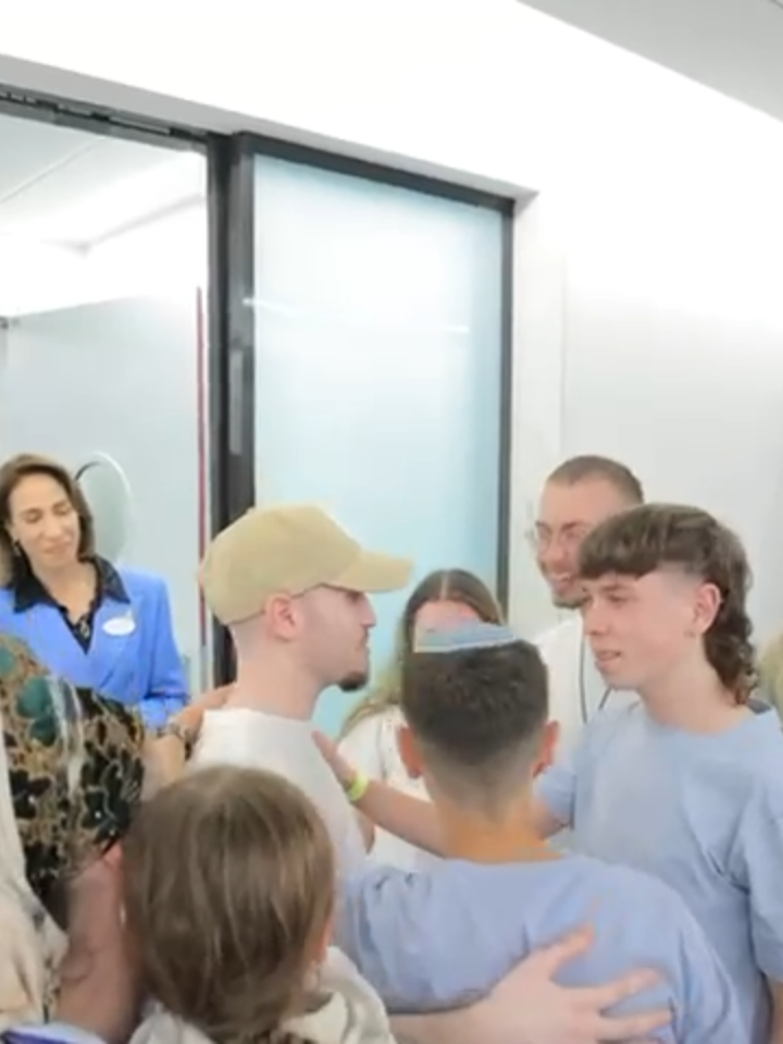 After being kidnapped on October 7, 2023, and surviving more than 2 years in H*mas captivity in Gaza, Eitan Mor arrives at an Israeli hospital and reunites with additional family members.  Credit: GPO