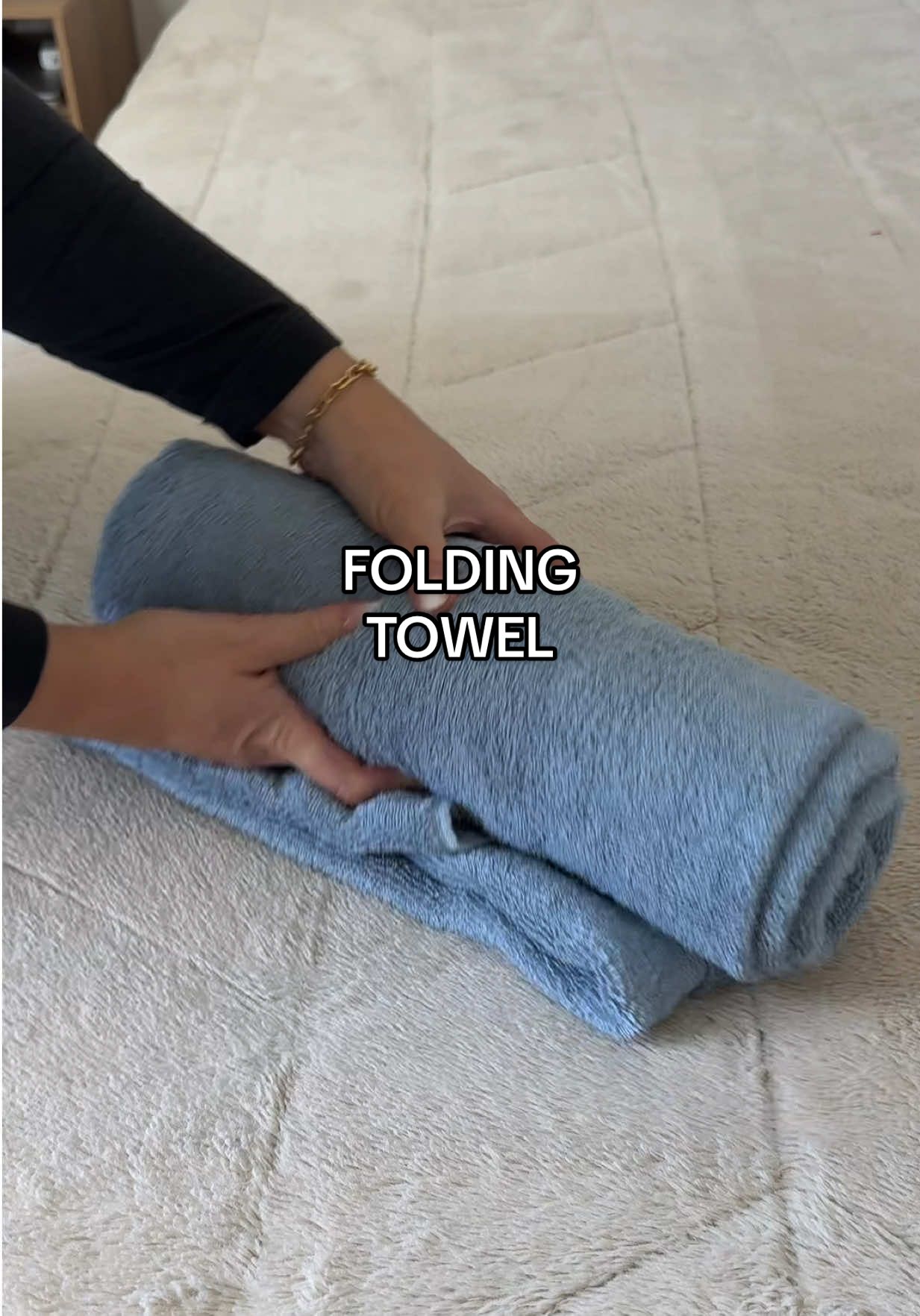 Neat towel fold that keeps everything looking organized and saves space in the closet. Quick move, smooth result. #TowelHack #FoldingHack #HomeTips #LifeHack #organizingtips 