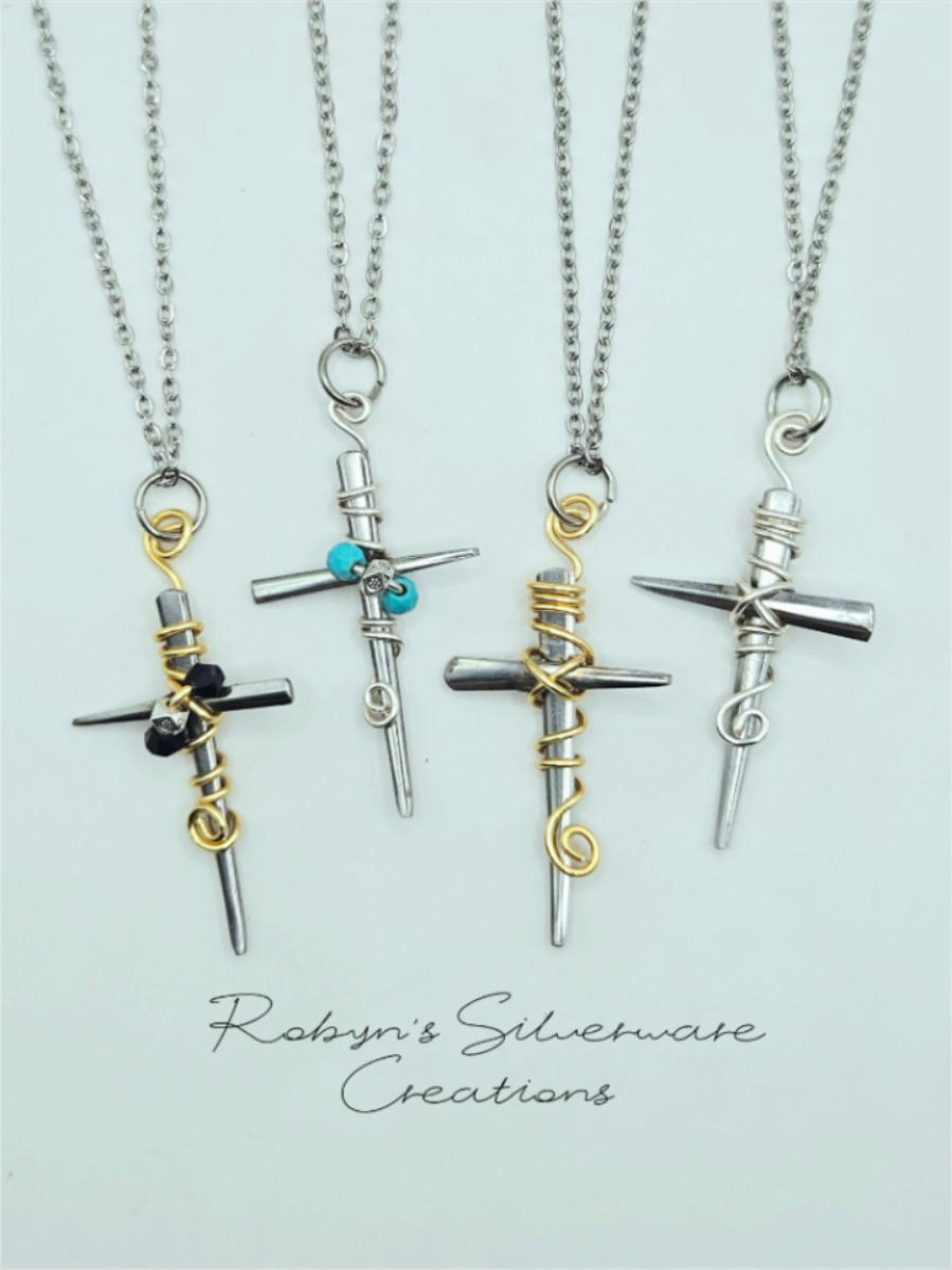 Fork tine crosses ✝️  These necklaces are made from stainless steel forks. I welded the tines together and added wire wrapping. Available on my website 🥰