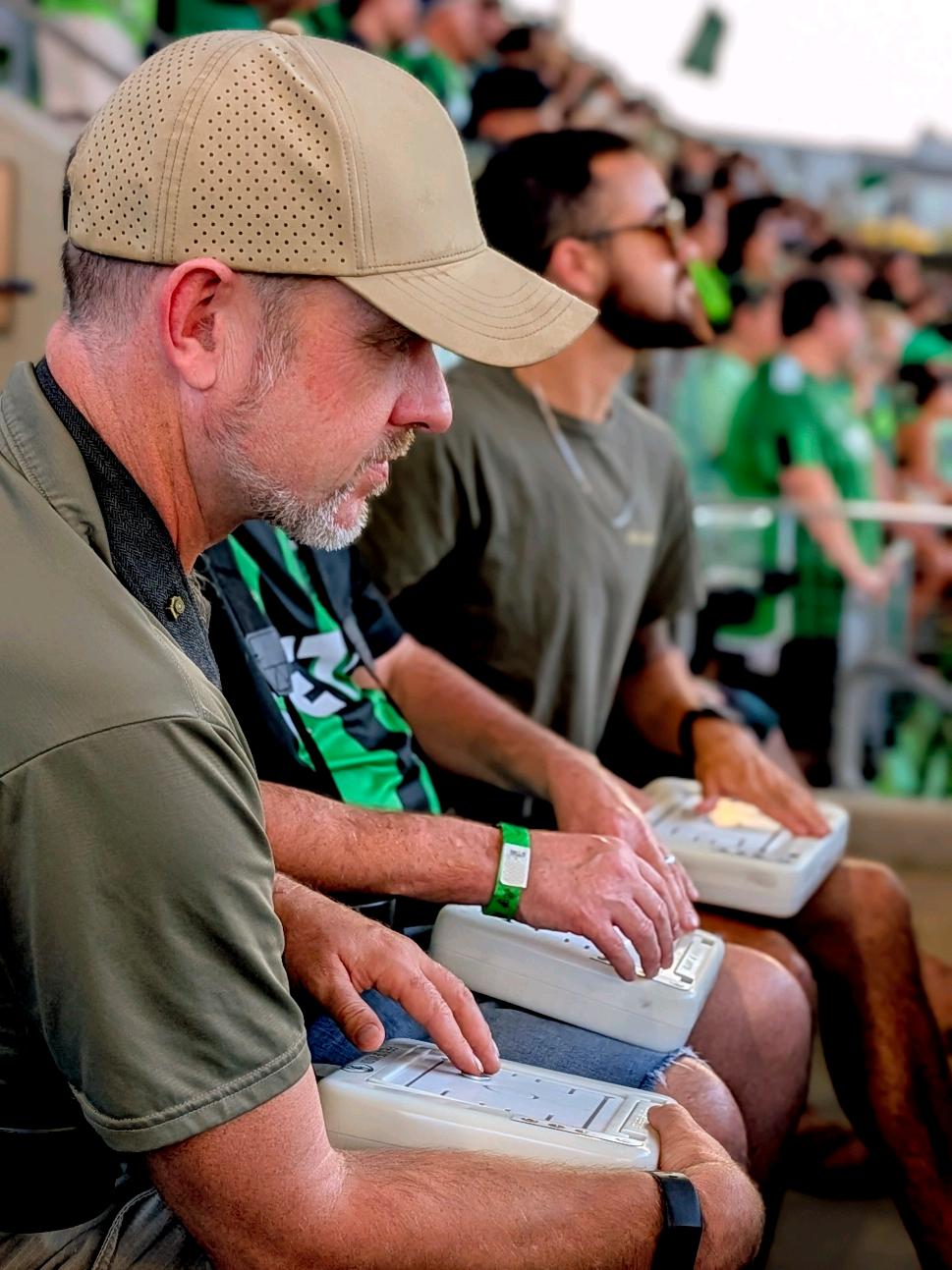 Listen to that atmosphere! These blind @AustinFC fans were able to follow the ball for plays such as this one during their exciting win at Q2 Stadium yesterday. Field of Vision helps blind and visually impaired fans experience live sport in real time. Our handheld touch-based device lets fans feel the movement of the ball, passes, and goals as they happen through haptic feedback. It works alongside live commentary, so fans can both hear and feel the game — making the stadium experience more independent and immersive. We partner with clubs, leagues, and major tournaments to make sport more accessible for everyone.