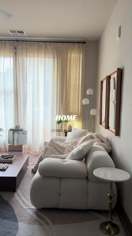 Morning light just hits different here. The soft curtains, warm tones, and cozy textures make it feel like slow mornings on repeat. ☕✨ #MorningLight #CozyLivingRoom #NeutralHome #ApartmentDecor #QuietLuxury morning light aesthetic, cozy living room, neutral home decor, apartment interior design, softnoteshome, minimalist apartment, ambient lighting ideas, neutral living room inspiration, cozy morning vibes, quiet luxury home