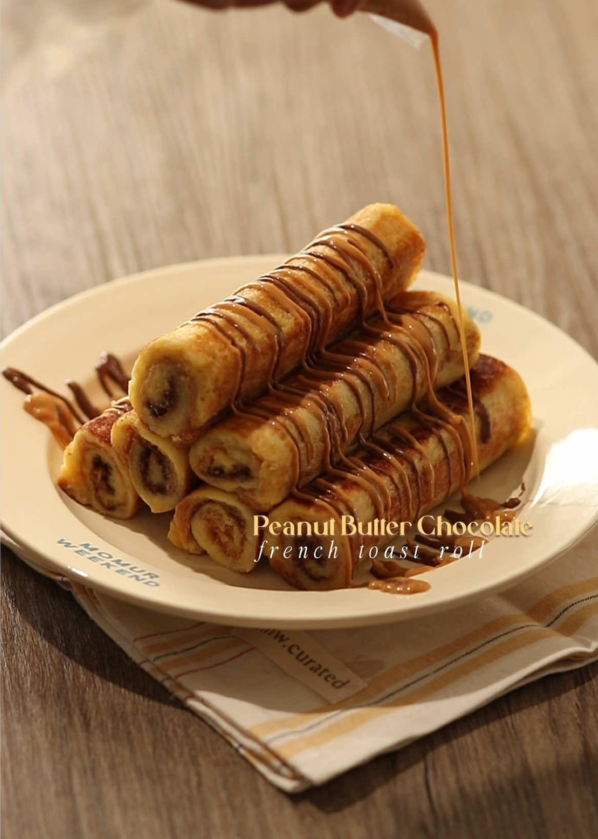 🥜🍫 Peanut Butter Chocolate French Toast Rolls 📝 Recipe 6 Slices • Bread 3 tbsp • Peanut Butter 3 tbsp • Chocolate Spread 1 Egg 30ml • Milk 1 tbsp • Butter Instructions: • Bread - flatten the bread with rolling pin - spread peanut butter on half of the bread - spread chocolate spread on the other half of the bread - roll the flatten bread - cut the edges of the rolled bread • Soaking; Bread - crack open 1 egg - pour milk and whisk everything - soak the bread in the mixture • Cooking; Bread - put butter on a pan in medium heat - fry the bread and flip every sides until golden brown • Finishing; PB Chocolate French Toast Roll - serve the french toast rolls with drizzle of peanut butter — #homecafe #peanutbutter #asmr #homecooking #frenchtoast 