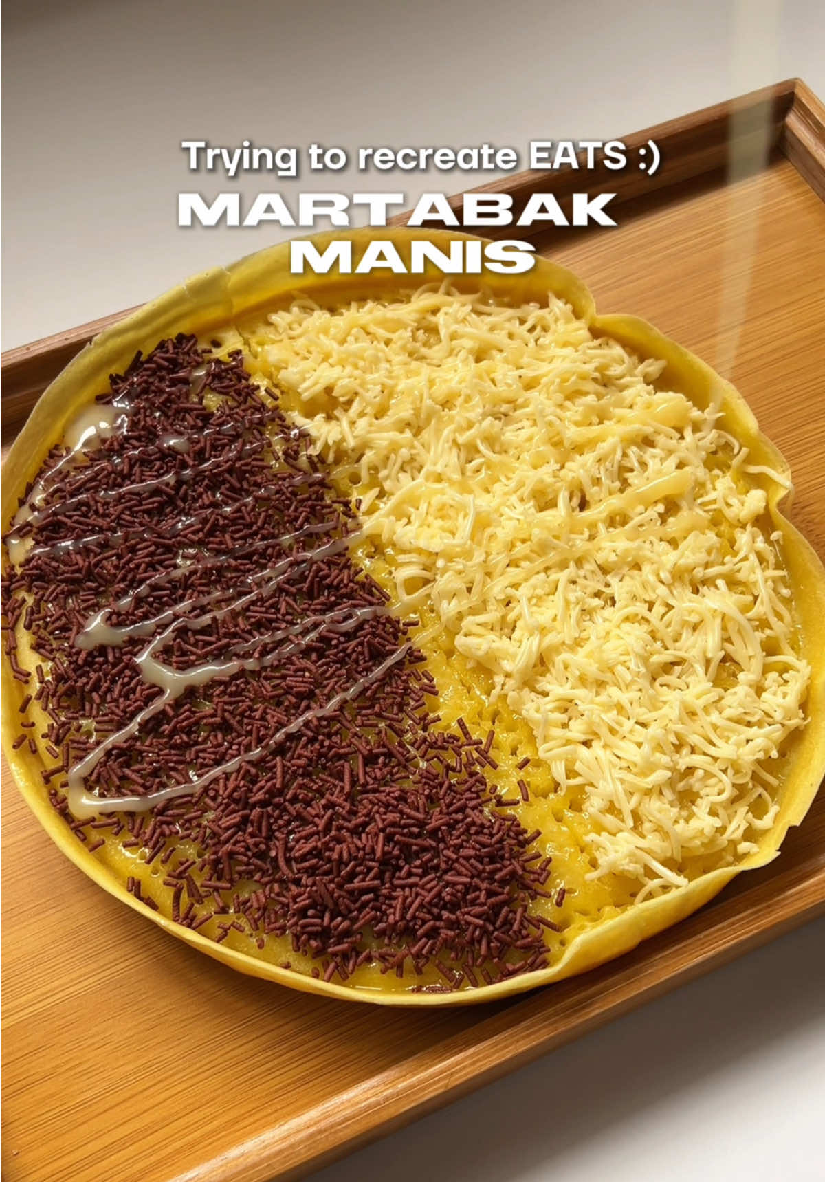 Ep 40: Martabak Manis 🍫🧀 (heavily influenced by the martabak girlie @Avrill Abigail 🤣) Recipe:  175g all purpose flour  35g white sugar 1/2 tsp salt  230ml water  1 large egg 1 tsp vanilla yellow food coloring (optional) 1/2 tsp baking powder 1/4 tsp baking soda 1 tbsp water  filling: sugar butter grated cheese chocolate sprinkles condensed milk Notes: Make sure the pan is preheated over medium heat. Lower the heat by one notch once bubbles start to cover almost the entire surface. This is also the time to cover the pan and let it cook thoroughly. To check if it’s cooked, lightly touch the surface - there should be no wet parts left. You can use chopped chocolate or chocolate spread. #martabak #martabakmanis #martabakrecipe #foodieph 