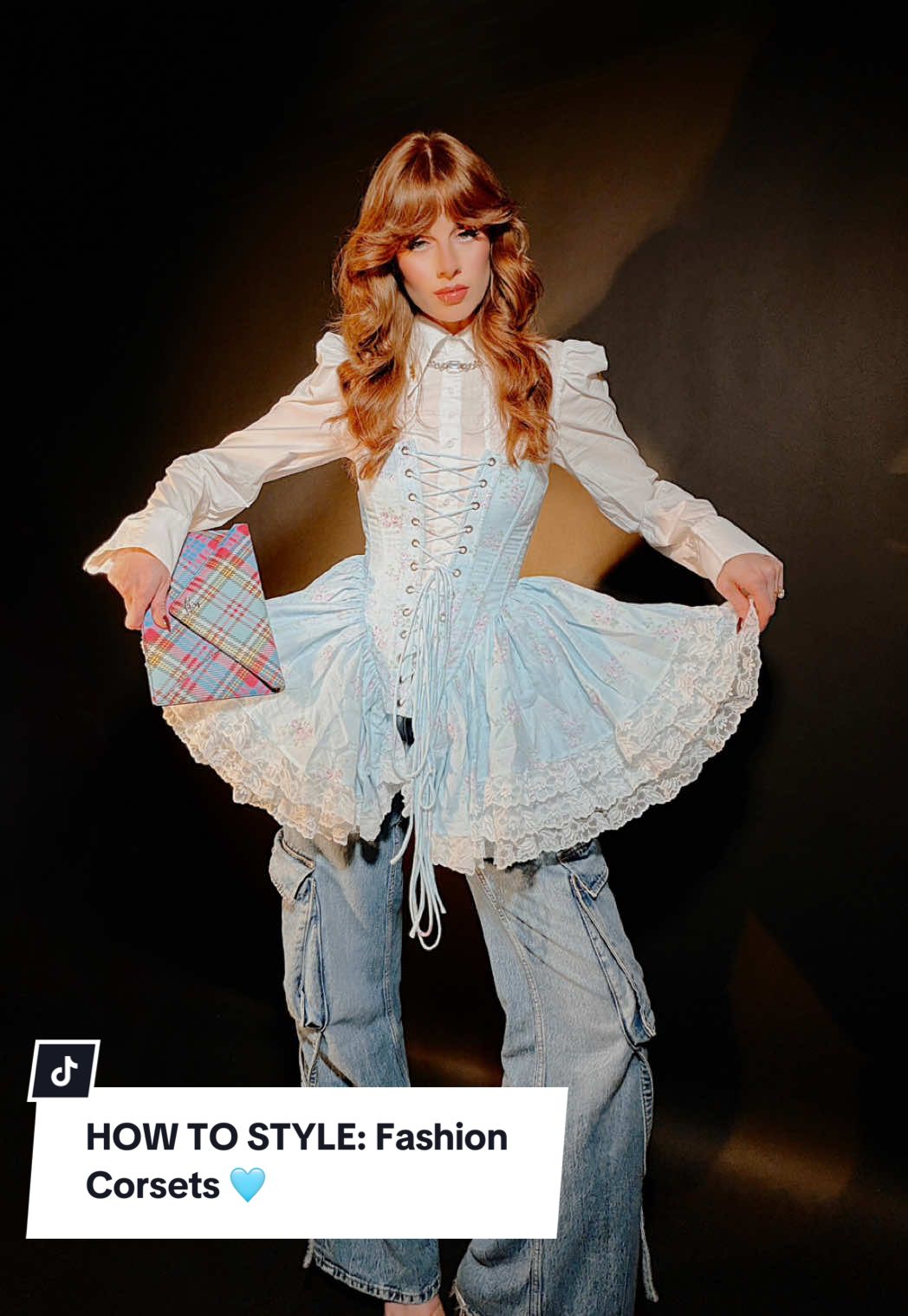 How to Style: Fashion Corsets 🩵✨ Vintage-inspired outfit ideas for Fall 🩵 From layering to pattern mixing, here’s how I would wear corsets with a modern vintage twist thats casual yet chic! Corset and discount code pinned to the top of my profile for ease 💋 Corset: @Selkie Discount Code: MAVERICK  Corsets are flattering, feminine, and a total wardrobe essential IMO 😉 — instantly elevating basics or dresses with a touch of vintage elegance and structure. Here are 4 ways I maximize them: 1. Pair with a white button down → instant white canvas for whatever corset you use 🔥   2. Wide leg pant → Balances the silhouette — I styled mine with blue jean cargos, but dress pants look equally chic ✨ 3. Add a pointy toe heel → adds elongated length and sexy finish to the pant leg 😍 4. Print Pairing → Choose a print or pattern in the same color family as your corset to create harmony — but still add visual interest through a subtle pattern clash. It keeps the look cohesive yet elevated and fashion-forward 🎨 #corset #vintagefashion #fallfashion #vintage #70s 
