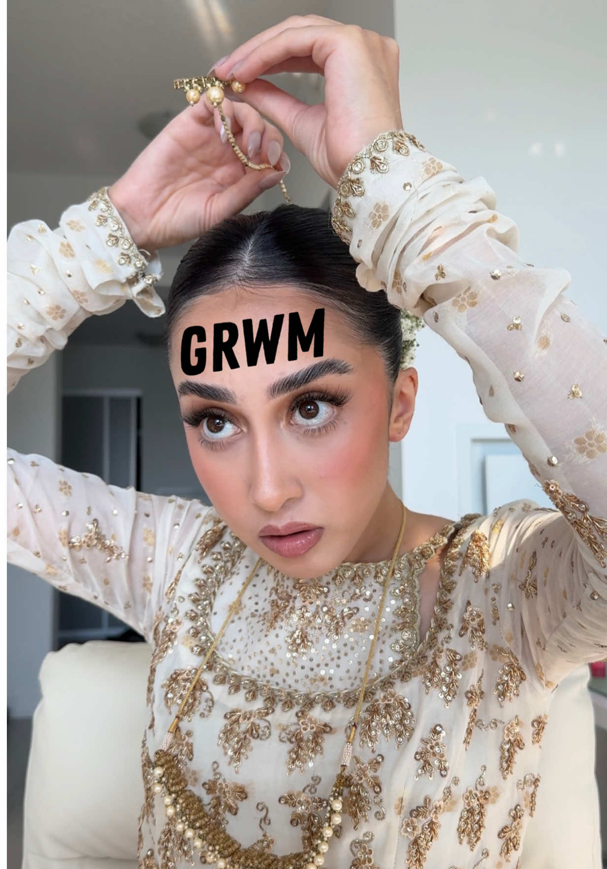 If anyone ever tells you to get bangs, they think you have a big forehead 😀 anyways get ready with me for a mehndi. there’s a lot of room for thoughts today. and bronzer. outfit @Farah Talib Aziz  hair @HairliciousbyMaria  flowers @Aleena | Lush Florals  @Glamnetic selenite nails  @urban decay slick brow @SHISEIDO lash curler @BenefitCosmeticsCA badgal bang waterproof @HouseOfLashes tigress lashes @Farmacy Beauty lip smoothie @milkmakeup hydro grip primer @milkmakeup jelly serum stick @Huda Beauty cherry blossom color corrector @Haus Labs foundation in 050 @hauslabs concealer fair neutral 04 @NARS Cosmetics laguna bronzer 02 @rhode skin freckle blush @Charlotte Tilbury pressed powder but this was limited edition :(  @essence.cosmetics baked blush @makeupforever wherever walnut liner (I think) @M·A·C Cosmetics Canada viva planet @YSL Beauty 44 loveshine gloss  @TIRTIR Inc. setting spray @tomfordbeauty soleil blanc perfume  #grwm #desi 