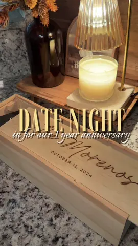 🤍 can’t believe we’ve been married for a year already! This year flew past us 🤭 we saved a wine bottle to open on our 1 year anniversary and saved the top tier of our wedding cake to eat! #datenightideas #datenightin #anniversary #weddinganniversary #couplesoftiktok 