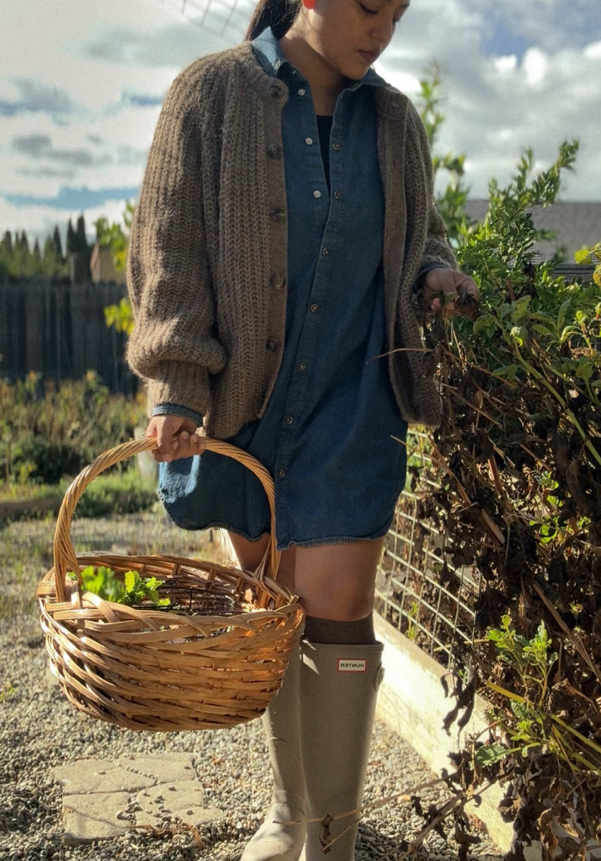 Her silly chickens and enchanted garden before the rain hits.