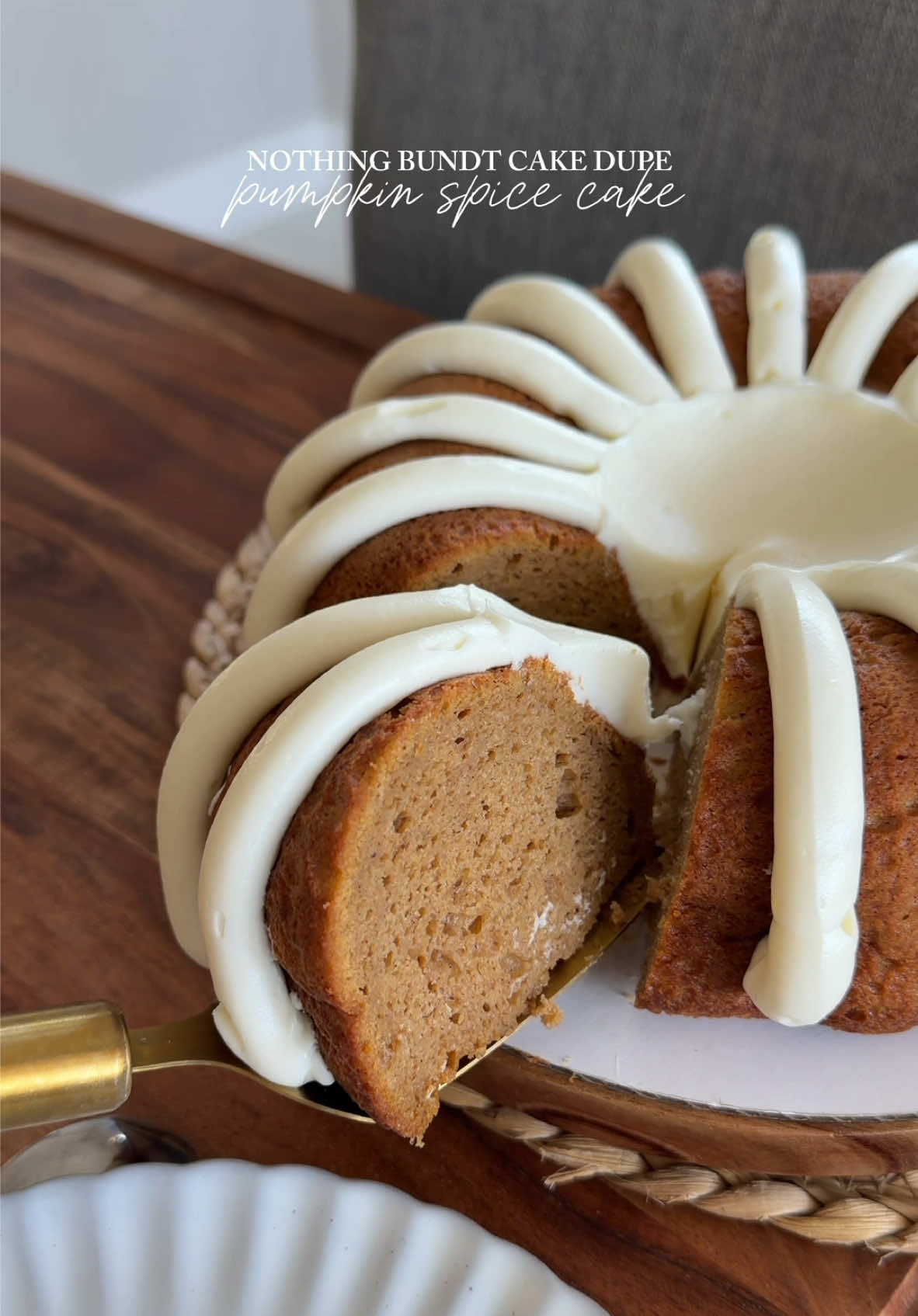 Pumpkin Spice Bundt Cake dupe 🎃Let me know which flavor you’d like to see next!  Recipe: 1 box Spice Cake mix (I’m using Betty Crocker) 1/2 cup canned pumpkin puree 2 tbsp pumpkin spice pudding mix, dry 1 cup of water  1/3 cup unsalted butter, melted 4 eggs 1/4 cup sour cream or Greek yogurt If you’re using a different brand cake mix, the water and butter quantities should follow the box you’re using.  Bake at 350F for about an hour. TIP: a toothpick needs to come out CLEAN otherwise your cake needs more time. Every oven is different and some need more time than others. Rule of thumb: clean toothpick!  Let it sit for about 10-15 minutes at room temp and then wrap in plastic while hot and freeze until it’s completely cooled (usually 1.5 hours). I ALWAYS flip it onto a tray so the cake doesn’t fall apart. This cake is EXTREMELY moist. It is fragile!  Cream cheese frosting: 8oz cream cheese, softened  1/2 cup unsalted butter, softened  2 cups powdered sugar 1 tsp vanilla extract  Beat softened cream cheese, add in butter and mix again until fully combined. Add in the powdered sugar, and vanilla extract, mix again until fully combined.  Enjoy :)  #nothingbundtcake #pumpkinbundtcake 