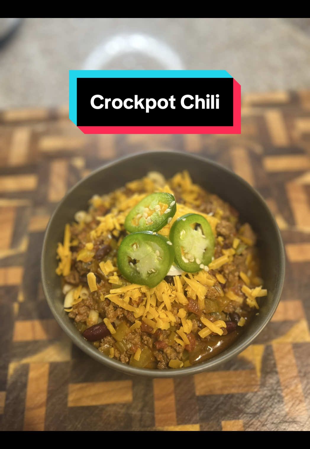 Crockpot Chili! Ingredients: Ground Beef - 1lb Ground Turkey - 1.3lb Adobo Seasoning Taco Seasoning  Sazon Packet - 2 Onion - 1 Bell Pepper - 1 Jalapeño - 2 Cubanelle Pepper - 1 Garlic - 6 cloves Celery - 4 stalks Black Beans - 1 can Red Kidney Beans - 1 can Diced Tomatoes w/green Chiles - 2 small cans Crush Tomatoes - 17.6oz Beer - 1 can Chili Seasoning Packet Beef Broth - 2c+ Heavy Cream - 1/2c Sharp Cheddar Cheese - 8oz Macaroni - 1lb Sour Cream  Directions: 1. First thing is to cook off the ground meat. Add to a hot pan and press down flat. Cook without moving for 5mins to get a good sear. Flip and break apart. Season with adobo, taco seasoning and a small packet of Sazon. Give it a good mix and continue until cooked through.  2. Add the meat to the crockpot. Then dump in the diced veggies: onion, bell peppers, celery jalapeños and cubanelle peppers. Then the minced garlic and beans. The pour in the diced tomatoes without draining, crushed tomatoes and a can of beer. 3. Then add a packet of chili seasoning and more of the adobo, taco and another packet of Sazon. It may seem like a lot of seasoning but this chili is very veggie dense it needs plenty of flavor added.  4. Pour in about two cups of beef broth, I used fat free low sodium. Give it all a good mix and then cook on high for 2-4 or low for 6-8hrs. With 30mins left add the heavy cream and cheese. Save some cheese for plating.  5. Once the cheese is melted laddle the chili over some macaroni noodles. Before you say anything this is ithinkican_cook Chili and that’s how we do it here 😂 6. Serve topped with some sour cream, more cheese and sliced jalapeños. Some Cholula chipotle hot sauce goes great as well. Enjoy! #chili #crockpot #crockpotrecipes #fallrecipes #crockpotchili 