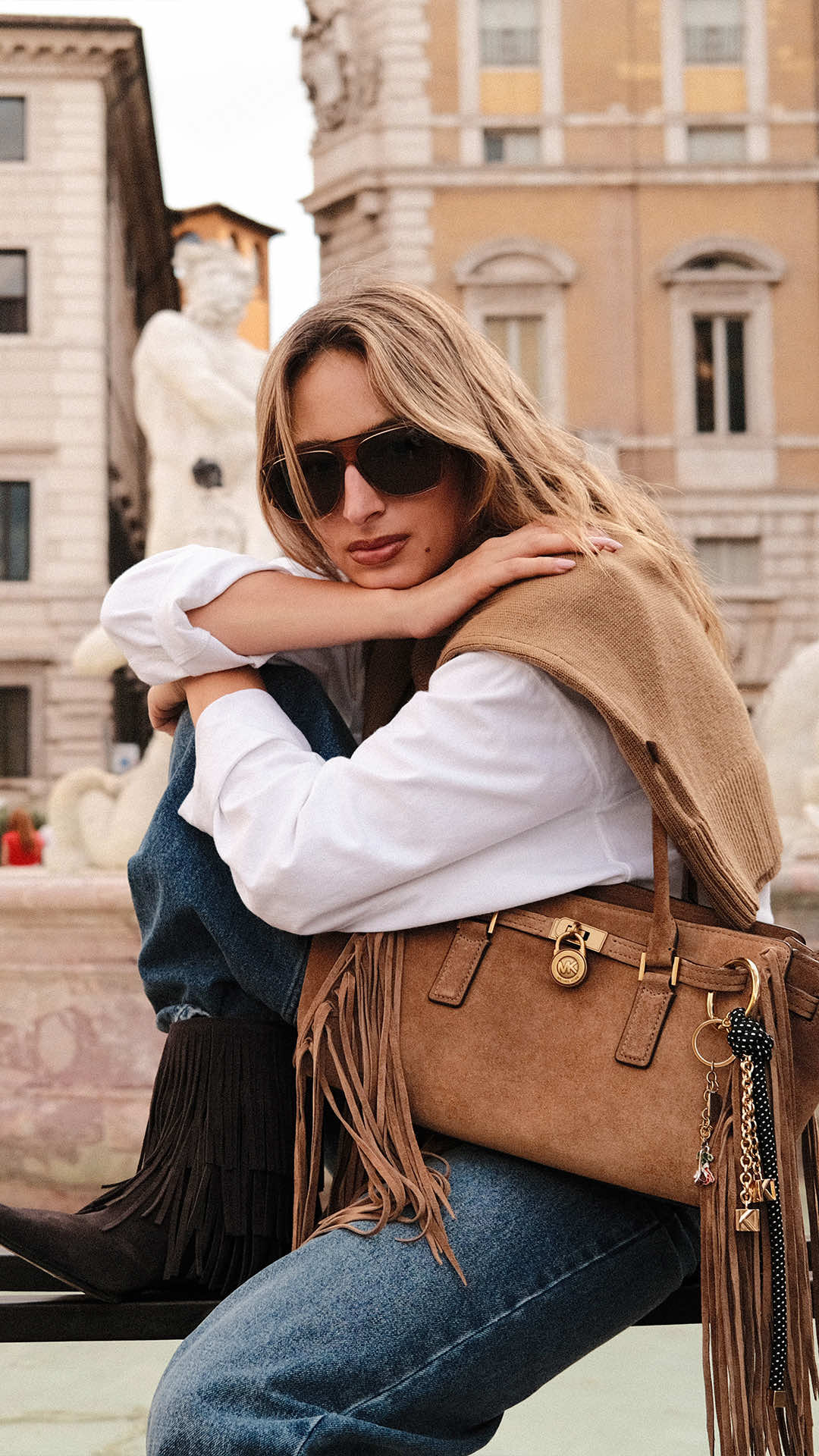 Style in the details. @IZZI and @Sarah Lysander in Rome with their fringed suede Hamilton Moderne bags. Hotel Stories: Rome, Fall 2025.  #MichaelKors #Rome