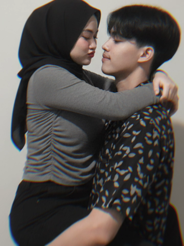 Let's make it as similar as possible to the reference image I sent. A couple, a man and a woman, are in a passionate embrace. The woman (as in the reference image) is held by the man, with her legs wrapped around his waist and her arms around or over his. The man (as in the reference image) has his right arm around her back and hips, while his left arm appears to be supporting her thigh. His face is close to hers, and he appears to be gazing at her affectionately. #gemini #prompt #ai 