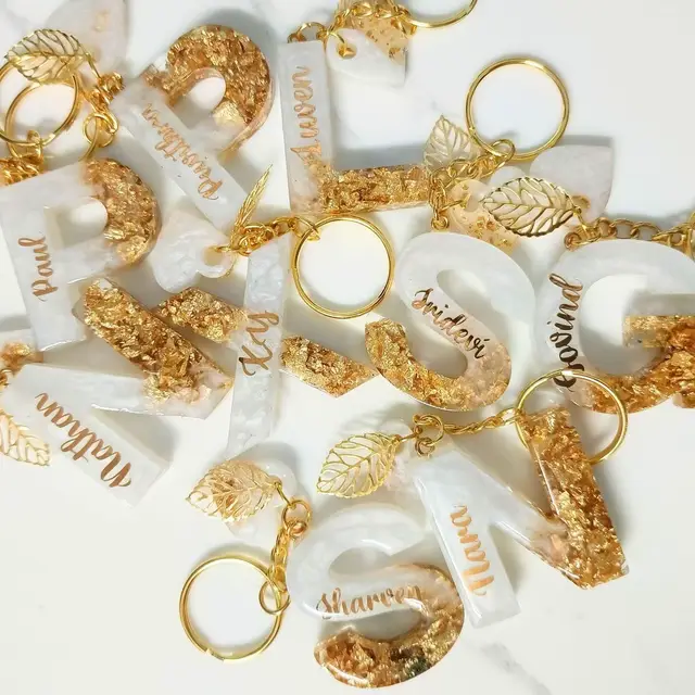 Resin keychain perfect for wedding,birthday,christening and any occasion souvenirs/giveaways ❣️✨ kindly DM for further details 📩 #resin #resinkeychain #resinletterkeychains #resinluxecreationsbylyn #handmade   