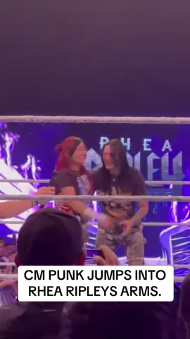 CM Punk jumps into Rhea Ripley’s arms.  #wwemelbourne #wweraw #smackdown #wwenxt #WWE