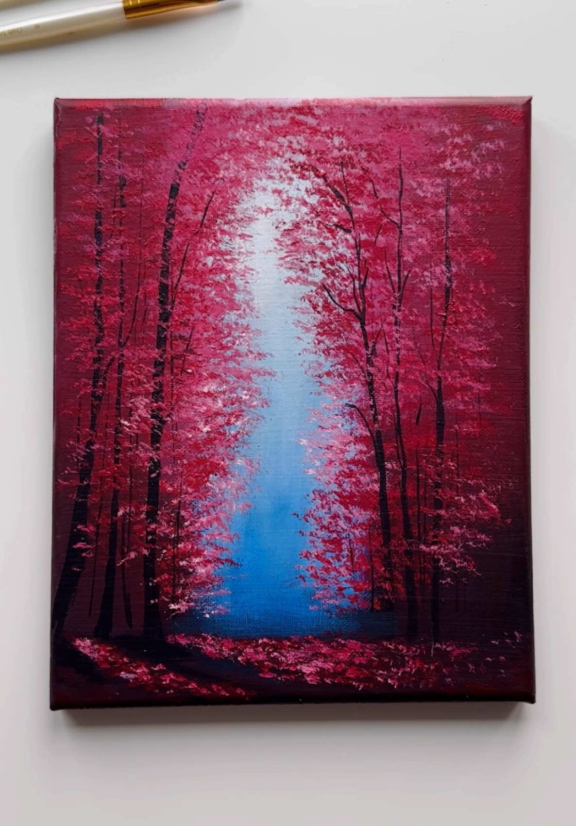 Crimson Pathway 🥀❤️ Recreating one of my old favorites — the Enchanted Forest. 🌸 I wanted to bring it back with a new touch of light and contrast — something anyone could try, yet it feels so magical every time I paint it. Would you walk into this glowing forest or just admire it from afar? 🌿💫 . . . . . . . . . . . . . . . . . . . . . . . #art #artist #tiktokart #painting #fypツ 