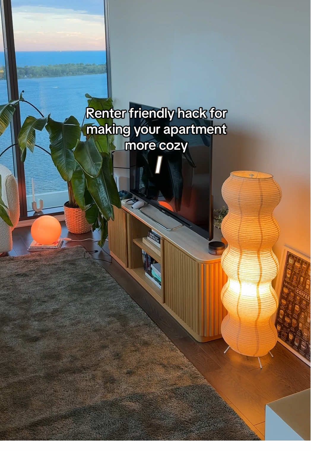 slowly making this place into our safe sanctuary 🤭  Found this paper lamp H&M home and I love this new addition !  #cozyhome #lamps #condodesign #renterfriendly #condoliving 