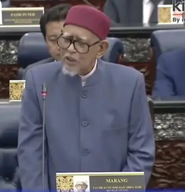 HADI AWANG’S LATEST HALLUCINATION: WHEN DELUSION REPLACES LEADERSHIP BY LOKMAN ADAM  There is a saying — *“When you can’t baffle them with facts, you dazzle them with bullshit.”* That perfectly sums up what PAS president Hadi Awang did in Parliament today. In a desperate attempt to cover up the escalating infighting within Perikatan Nasional — especially between PAS and Bersatu over who should be their so-called “Prime Minister candidate,” Hadi unleashed one of the most bizarre explanations ever heard in Malaysian politics. According to him, PN has not announced its PM candidate “to safeguard their safety.”He went on to claim that revealing the name too early could lead to the person being framed  with *gold bars placed in their car*, or *drugs planted* on them. Seriously? This isn’t a political strategy — it’s a bad script from a second-rate drama. Hadi expects Malaysians to believe that PN’s imaginary Prime Minister candidate is hiding from phantom gold bars and invisible enemies. What an insult to the intelligence of every rational voter in this country. The truth is far simpler — and far uglier. PN has no Prime Minister candidate because their internal feuds have gone beyond repair. Bersatu wants its man. PAS wants its own. Gerakan doesn’t even know why it’s there. PN is cracking at its core, so Hadi hides behind laughable conspiracy theories. It’s a tired tactic — the same kind of fear-mongering that has long replaced reason in his brand of politics. Hadi may continue to mesmerize his hardcore followers — those who have long surrendered their thinking ability to him — but the rest of Malaysia isn’t buying it. The rakyat can see through the act. A coalition that cannot even decide on a leader has no business talking about leading a nation. And Hadi Awang is  a man who trades in delusion should not be taken seriously when the country is demanding direction, not drama. #LokmanNoorAdamOfficial #UMNOMalaysia #BarisanNasional #SoladiritiNajibRazak #ZahidHamidi  
