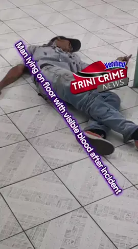 Man lying on floor with visible blood after incident 