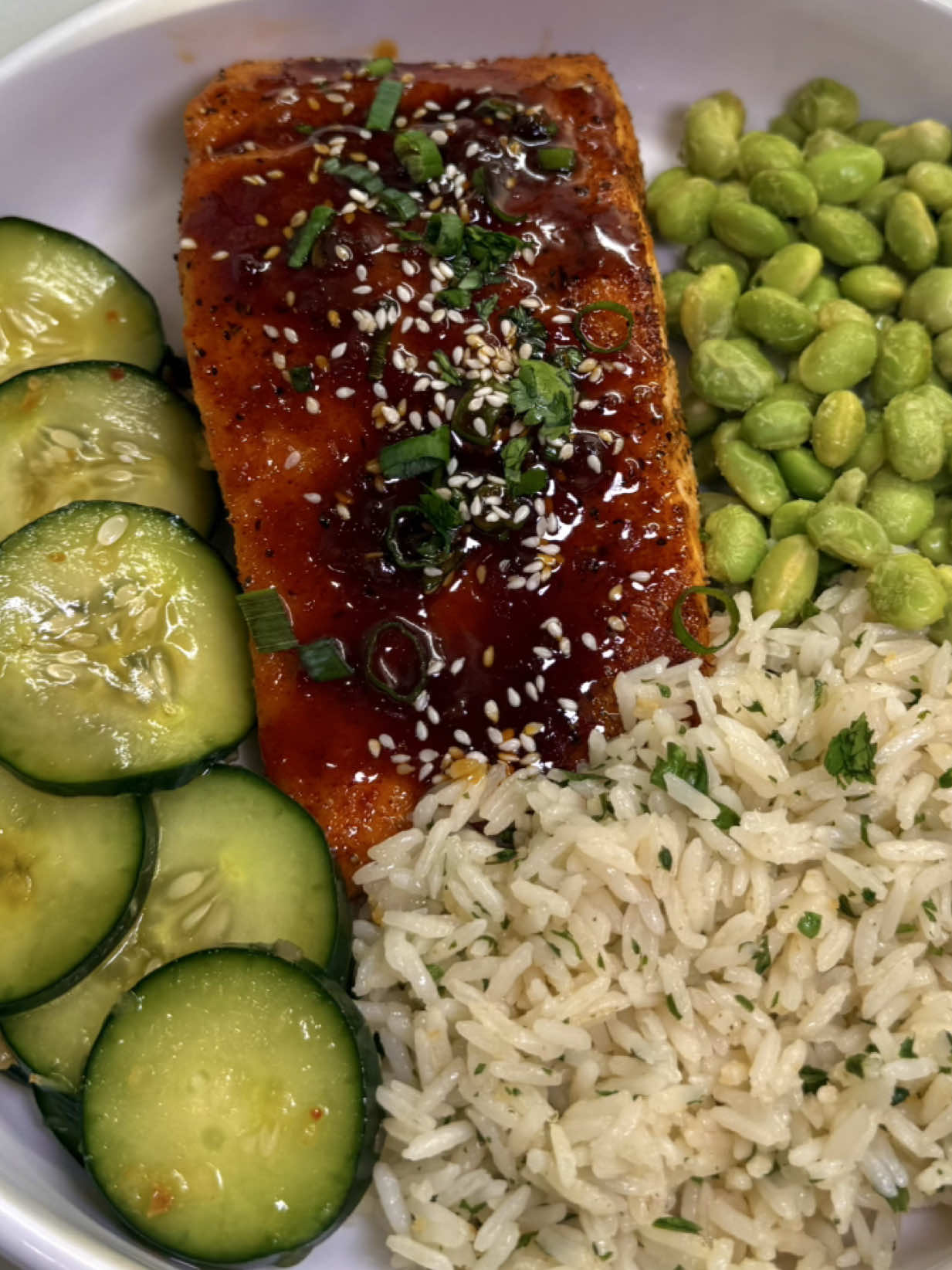 🐟 Asian Glazed Salmon - so easy & delicious!!  For the salmon: * 2–3 salmon fillets (6 oz each, skin-on) * Salt * Pepper * Garlic powder * Onion powder * Smoked paprika For the glaze: (double sauce if you want extra) * 1/4 cup low-sodium soy sauce * 2 tbsp honey or hot honey  * 1 tbsp rice vinegar (or lime juice) * 1 tbsp sweet chili sauce or hoisin * 1-2 tsp sesame oil * 2 tsp neutral oil  * 2-3 cloves garlic, minced * 1 tsp ginger garlic paste * 1 tsp sriracha ***adjust sauce to your liking***  For garnish (optional): * Sesame seeds * Thinly sliced green onions * Lime wedges 🔥 Instructions 1. Make the glaze: In a small saucepan, combine soy sauce, honey, rice vinegar, sweet chili sauce, sesame oil, garlic, ginger paste, and sriracha. Bring to a simmer over medium heat and cook for 3–4 minutes until slightly thickened. Add a splash of water if needed. Remove from heat. 2. Prepare the salmon: Pat salmon dry and season with salt, pepper, garlic powder, onion powder and smoked paprika. 3. Cook the salmon: Air-Fry salmon at 385 degrees for 8-10 minutes or until cooked through. When there is 2 minutes left to cook, glaze salmon with sauce and cook the rest of the way.  4. Garnish & serve: Drizzle remaining glaze over salmon and top with sesame seeds, green onions, and lime. #fyp #viral #DinnerIdeas #EasyRecipe #foryoupage 