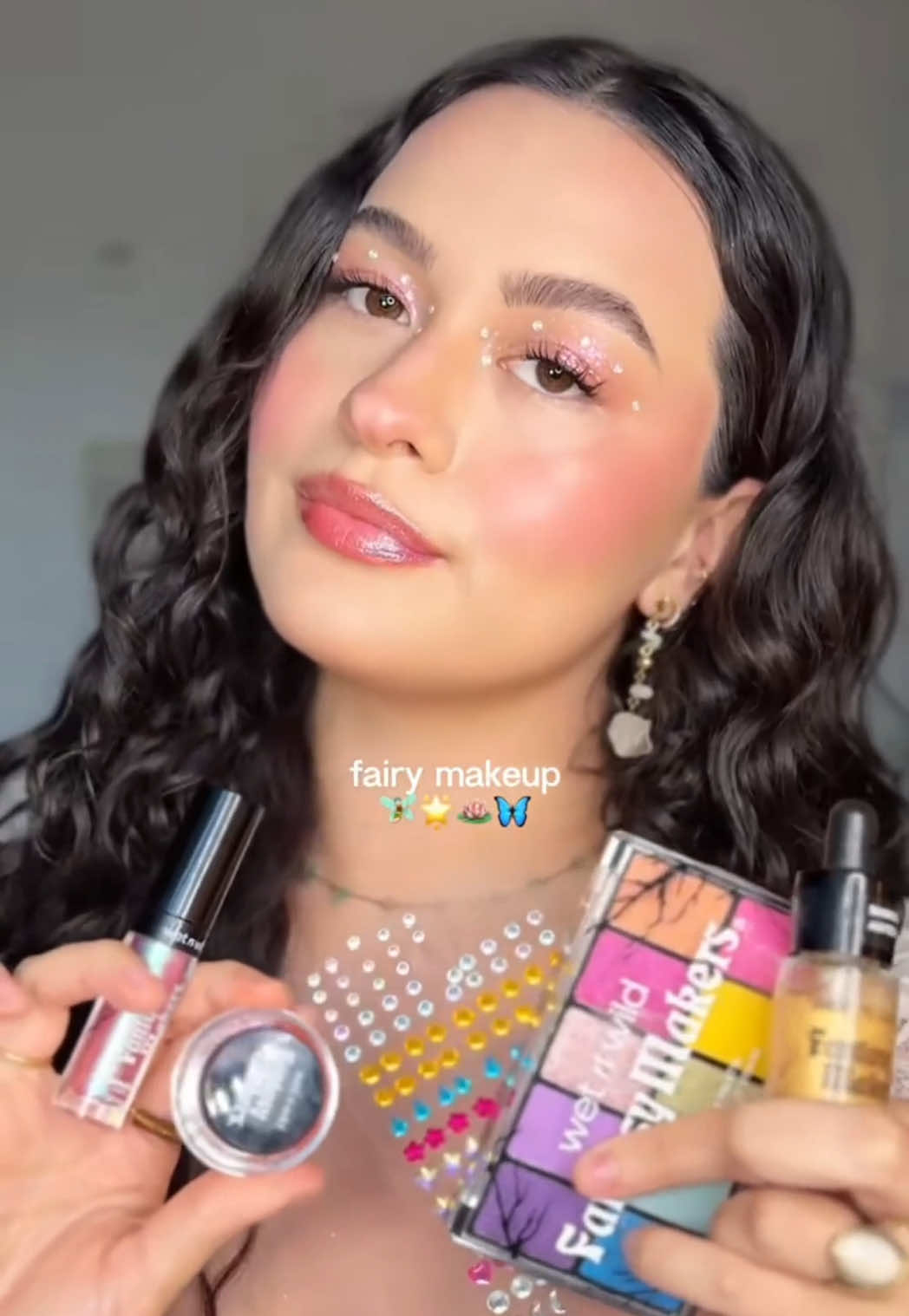 @SOPHI⁠ is looking magical in our Fantasy Makers Collection 🧚‍♀️✨⁠ ⁠ Recreate this simple & festive look with: ⁠ 👑 Eye & Face Palette in Queen of Brights⁠ 💛 Chameleon Chrome Eyeshadow Foil in Mariposa Magic⁠ 💎 Individual Gems in Sparkling Spell⁠ 🩷 Chameleon Chrome Lip Foil in Nymph’s Whisper⁠ 💫 Glitter Body Illuminator in Fountain of Gold⁠ ⁠ Shop the Fantasy Makers collection NOW @walmart (online & in-store) @target @cvs_pharmacy @walgreens ⁠@fivebelow @amazon & wetnwildbeauty.com ⁠ 
