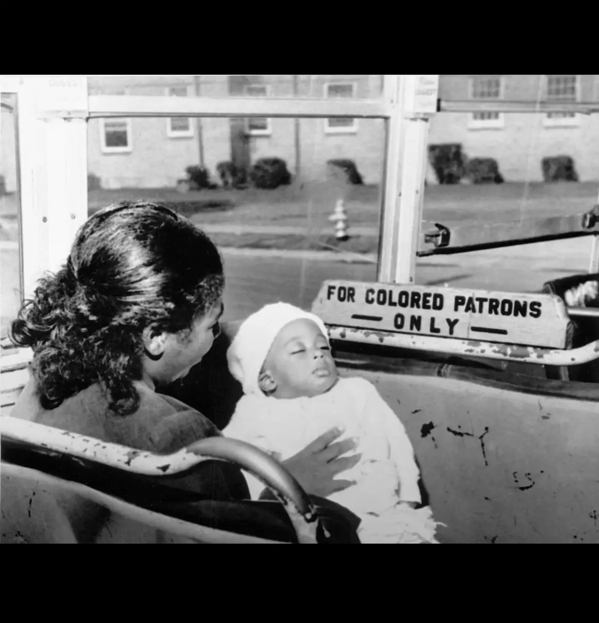 Mother sits at the edge of the sign segregating the bus, circa 1950s. #fyp #fyppp #blackhistoryfacts #blackhistory #fypシ゚ 