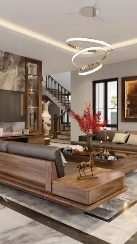 Phòng khách sang trọng với thiết kế hiện đại pha nét cổ điển, nổi bật nhờ tông gỗ nâu ấm và ánh sáng vàng dịu đầy tinh tế. Bộ sofa da cao cấp kết hợp bàn trà gỗ nguyên khối mang lại cảm giác vững chắc và đẳng cấp. Chiếc đèn trần xoắn ốc kim loại ánh vàng tạo điểm nhấn độc đáo cho không gian, trong khi bình hoa đỏ rực trên bàn trung tâm làm bừng sáng cả căn phòng. Đây chính là định nghĩa của “đẳng cấp và tinh tế” trong thiết kế nội thất hiện đại.#noithatsangtrong #phongkhachdep #noithatluxury #noithatgooccho 