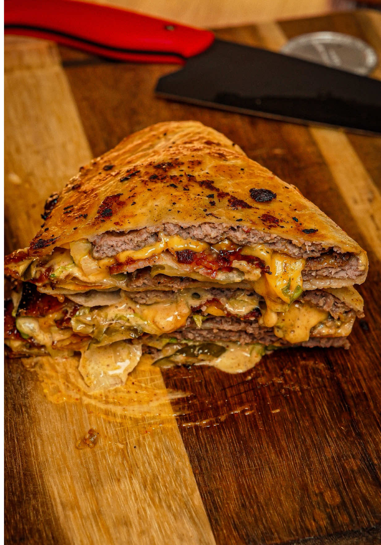 Smashburger Quesadilla Recipe👇🏾💰 I’m sure you’ve heard of smashburger tacos by now… but have you tried smashburger quesadillas? 👀 Pretty much the same idea just bigger, cheesier, and packed with flavor! Inspired by my homie @Nick Nesgoda these came out hella good adding that sweet-heat Cajun kick from my Cajun Honey Rub  available now @tftibbqshop  Perfect for game day, late-night munchies, or just flexin’ your griddle skills. Crispy, cheesy, beefy goodness in every bite straight MONEY! 💰 Ingredients: • Large flour tortillas  • Ground beef • My Cajun Honey Rub @tftibbq.shop  • Bacon • American cheese only! • Shredded Lettuce • Pickles Mac sauce: • 1/2 cup Kewpie mayo • 2 tbsp @Melinda's Hot Sauce Jalapeño ketchup • 1 tbsp yellow mustard • 1 tbsp pickled relish  • 1 tbsp Cajun Honey Rub Griddle: @Char-Griller  Burger Press: @mmbbqco  Insulated bowl: @YETI  Knife: @Montana Knife Co  #smashburger #quesadilla #EasyRecipe #gamedayfood 